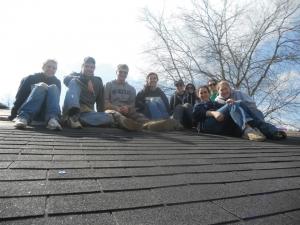 Contributed photo: Students pose for a picture on the roof during the Habitat for Humanity spring break trip.